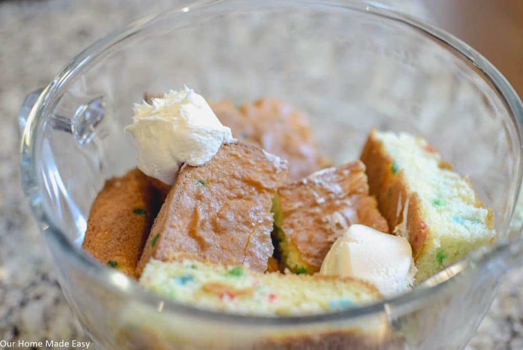 Crumble the cake into a bowl, add your icing, and mix it all together