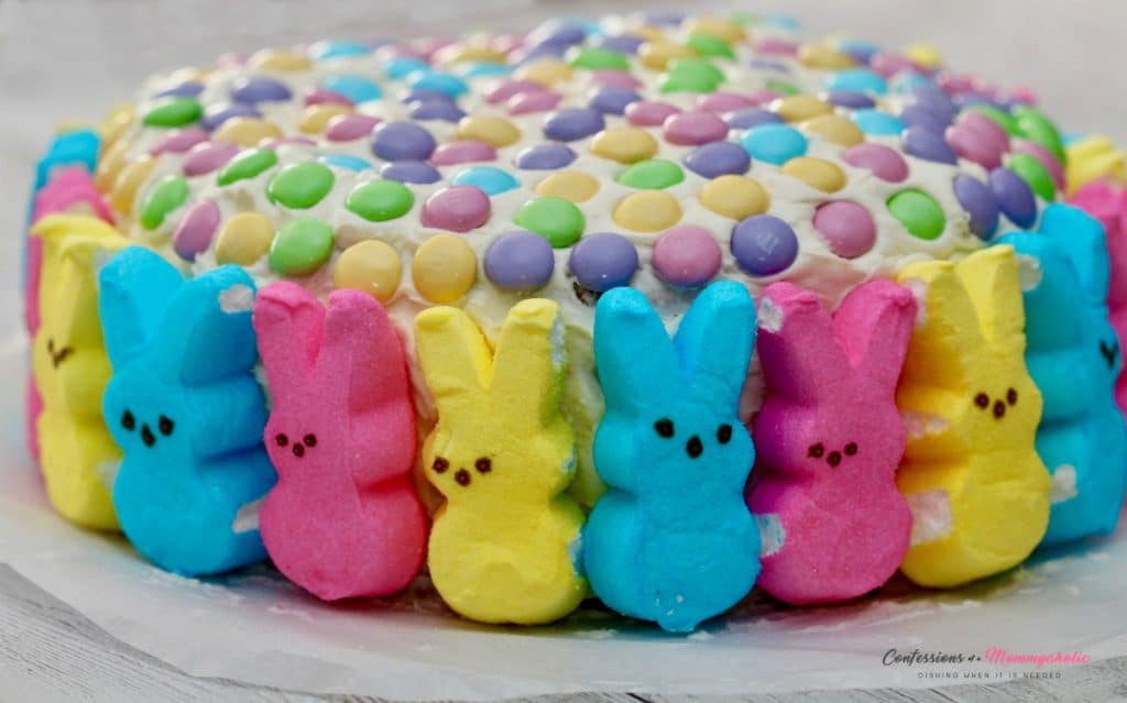 This adorable Easter cake is topped with Cadbury eggs and sweet Peeps bunnies