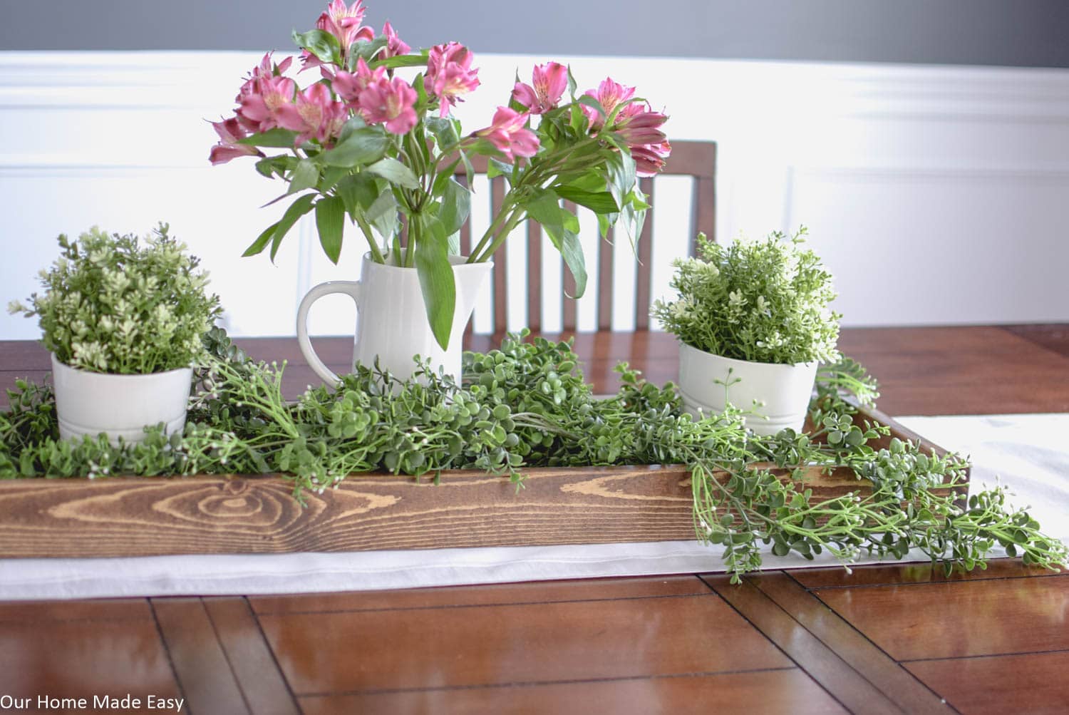 Add some height in your Spring centerpiece with vases. I chose simple white porcelain vases 