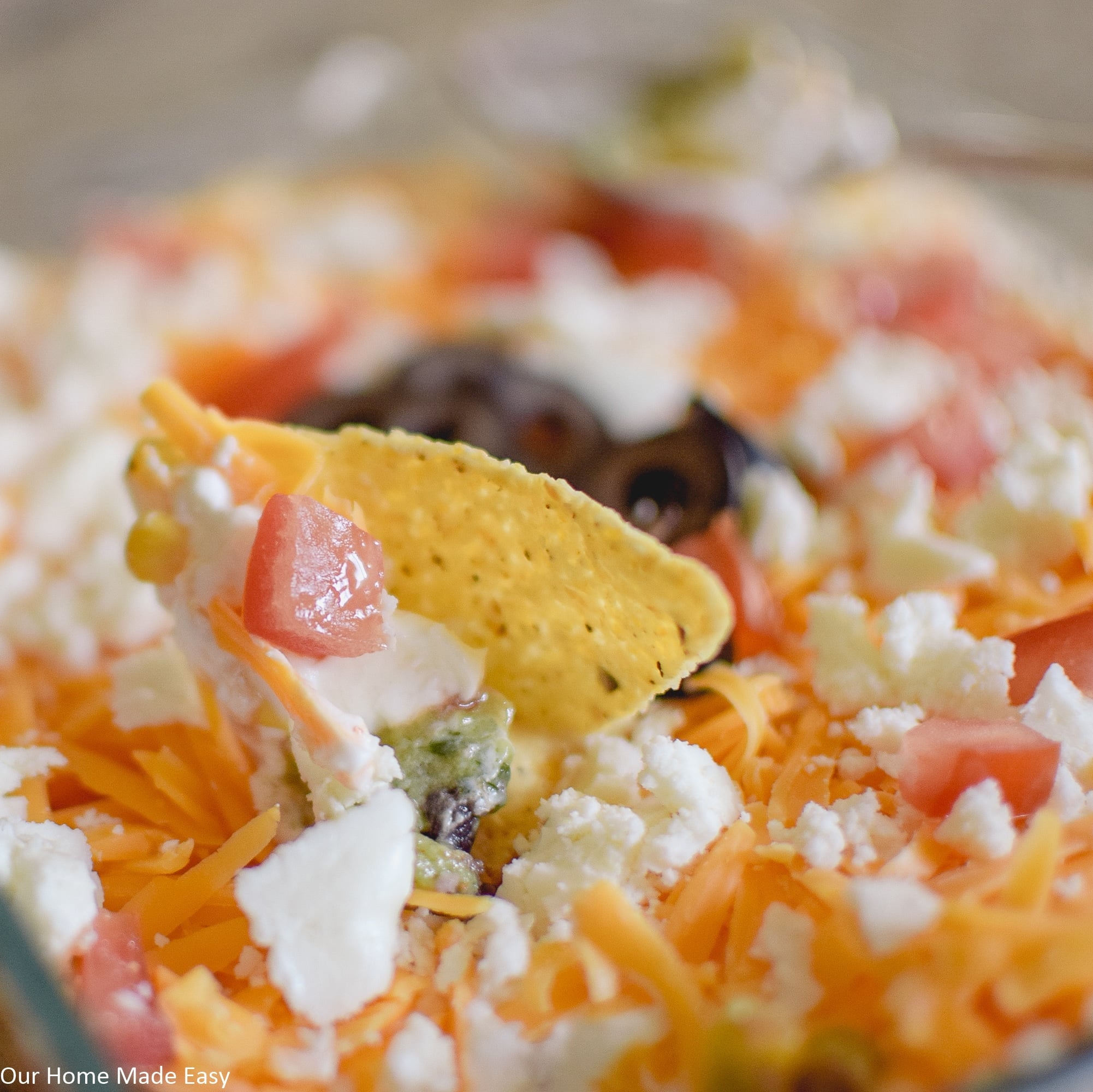 this easy 7 layer taco dip is perfect for parties - the whole crowd will enjoy it