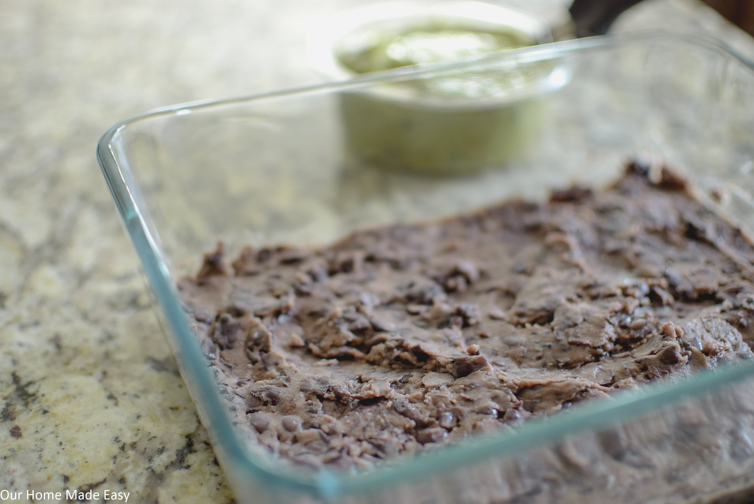 the base of this easy 7 layer taco dip is refried bean