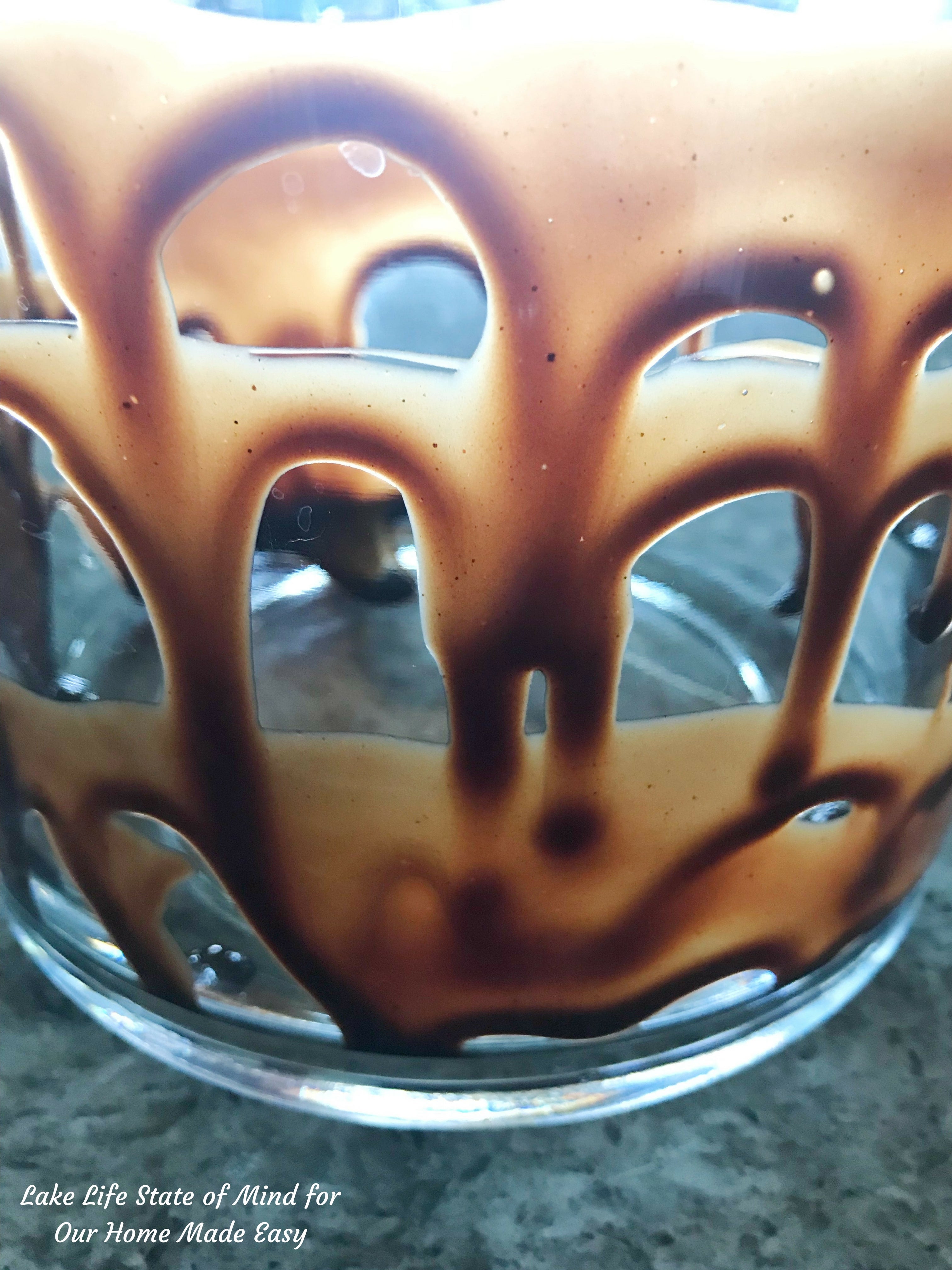 Decadent chocolate syrup coats the inside of the ice cream dish 