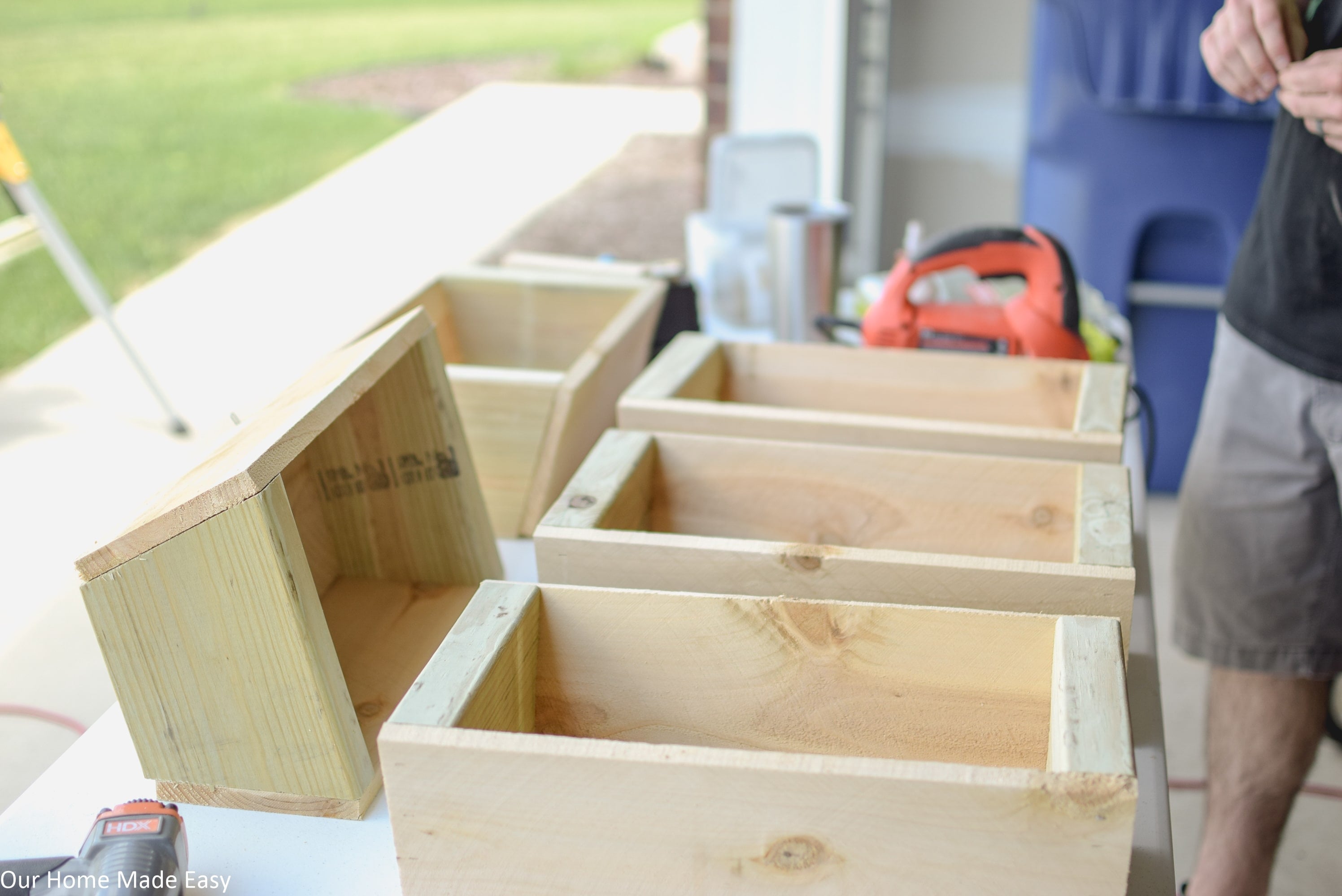 I enlisted Jordan to help me make the baskets for my DIY cedar ladder planter