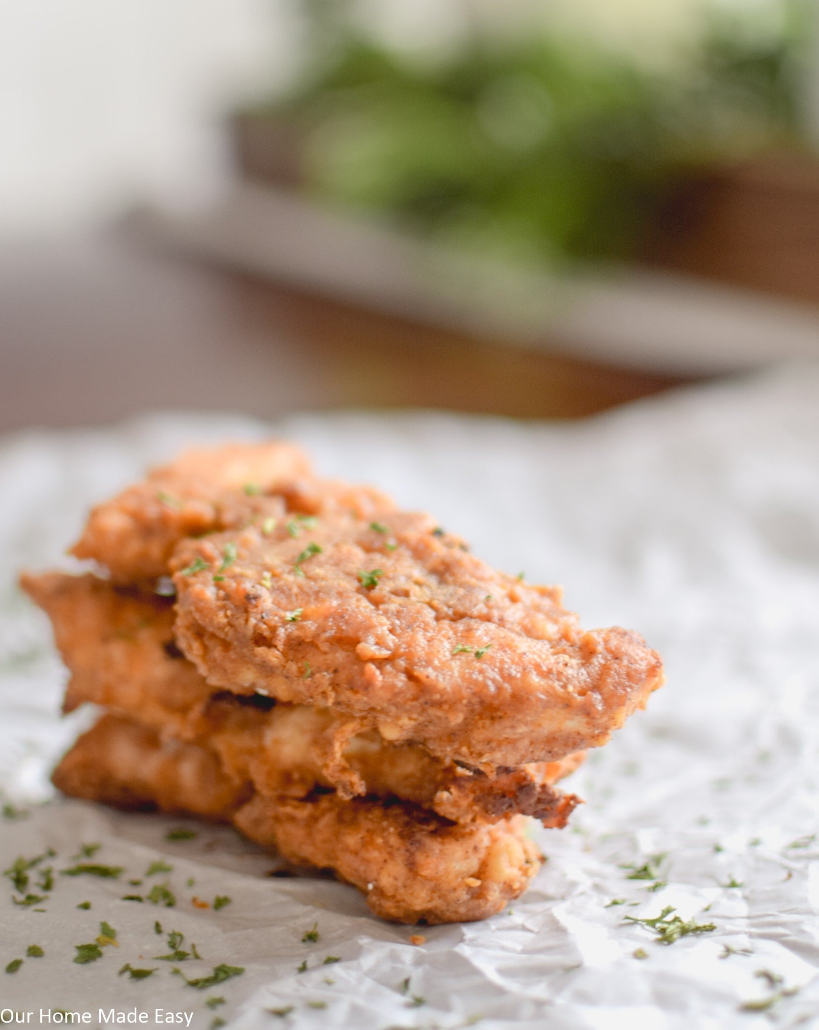 Delicious oven baked chicken tenders coated in a perfectly seasoned crispy breading