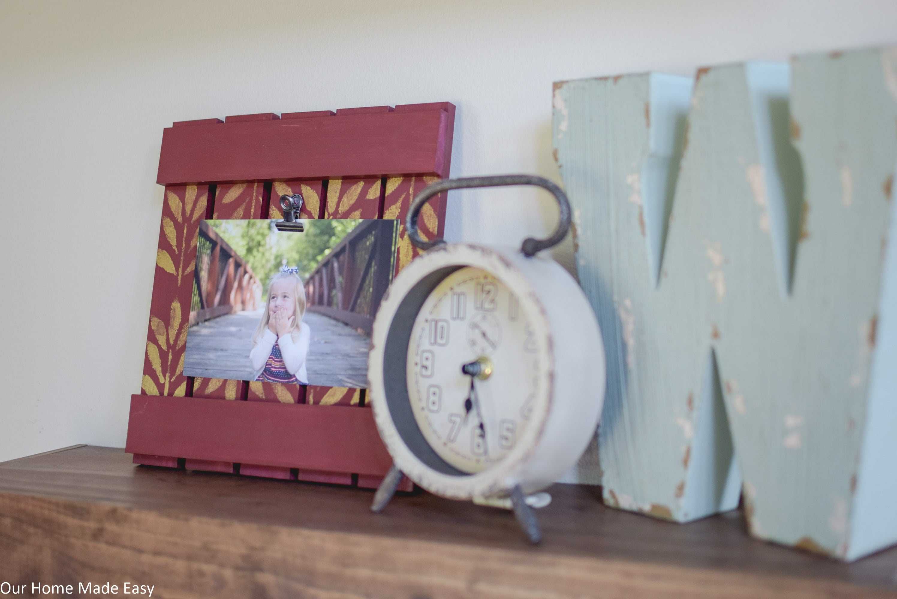 This simple DIY picture frame is made from reclaimed wood and will look perfect on your mantle