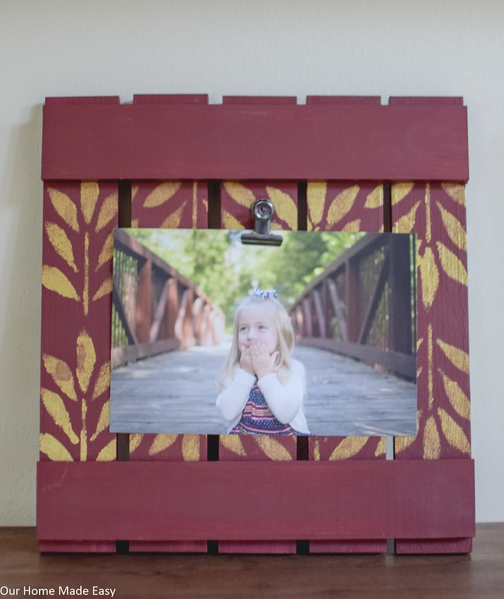 Complete the wood picture frame by attaching a picture clip to hold the picture