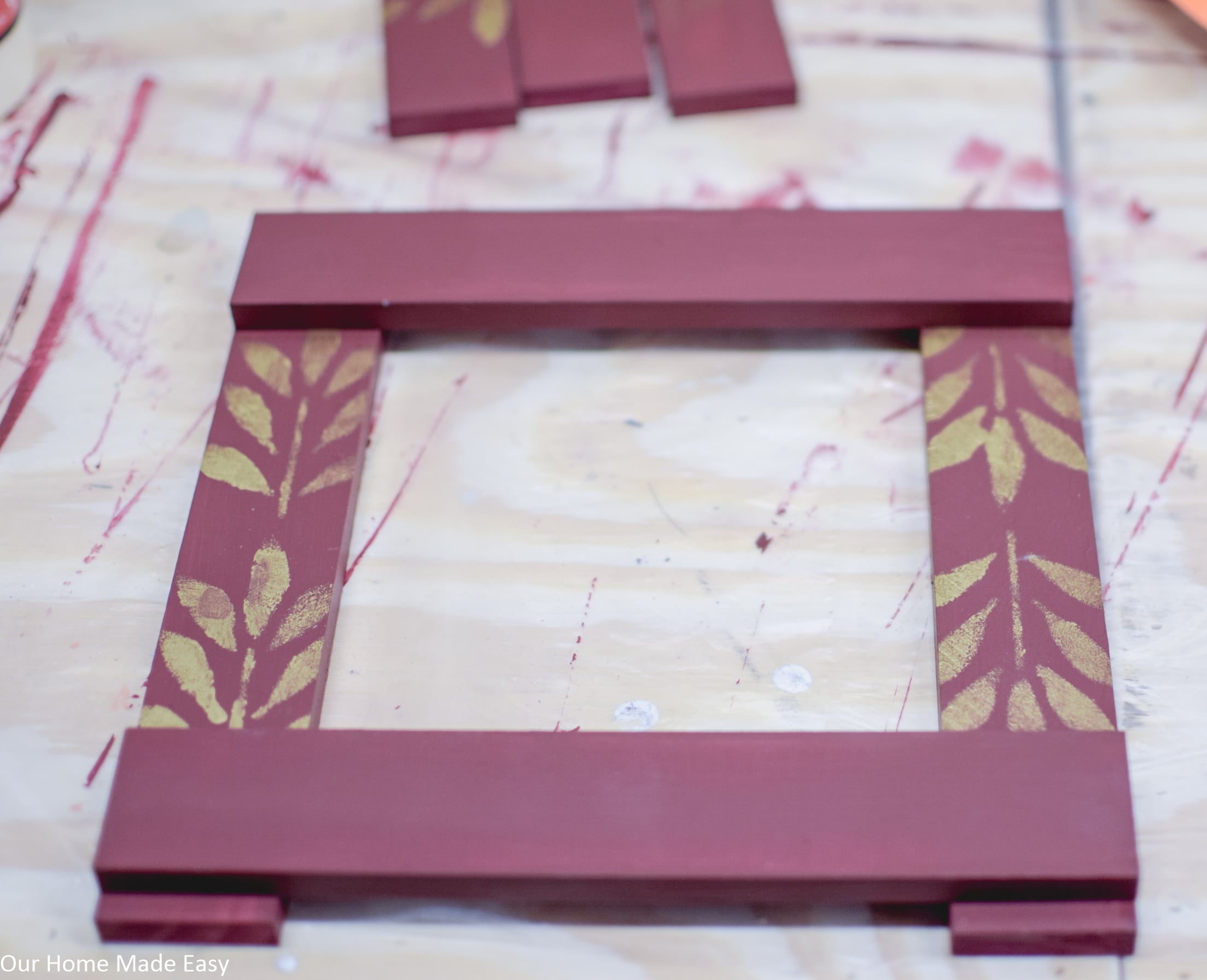 Begin gluing together the wooden slats to form the picture frame