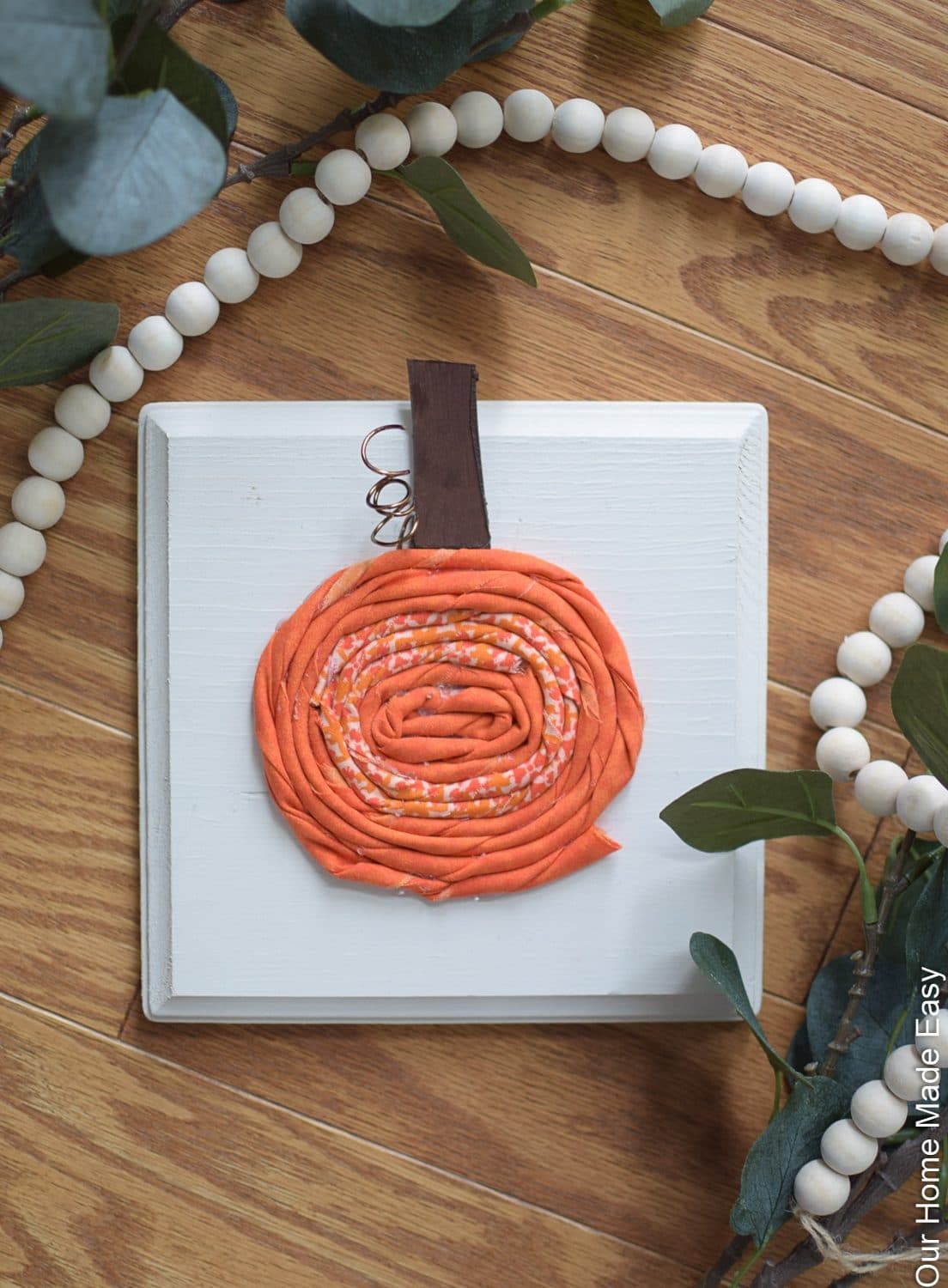 Making these cute fabric pumpkins is a fun way to add DIY fall decor to your home