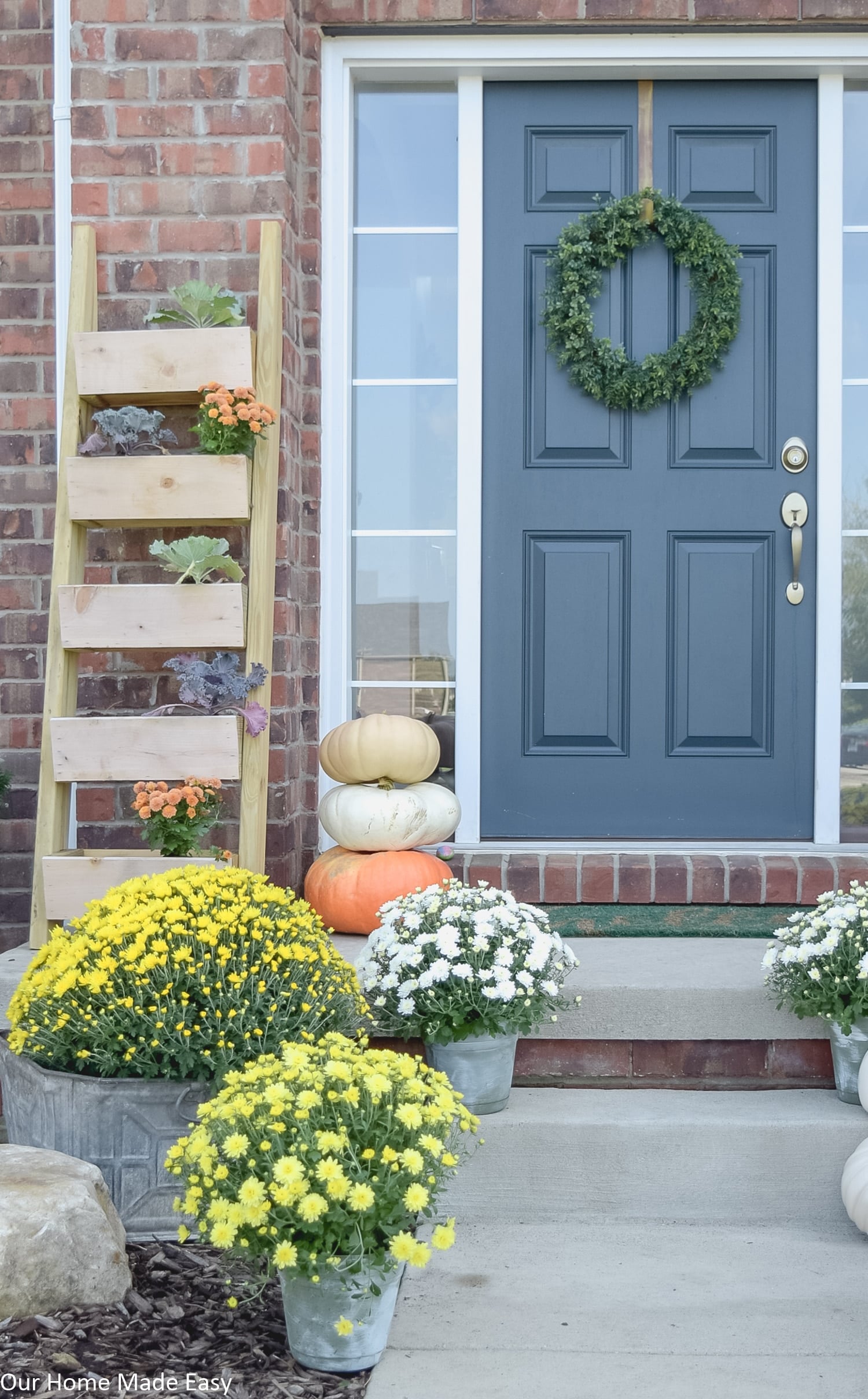 bright colored potted mums are an easy way to add a fresh, fall touch to your front porch