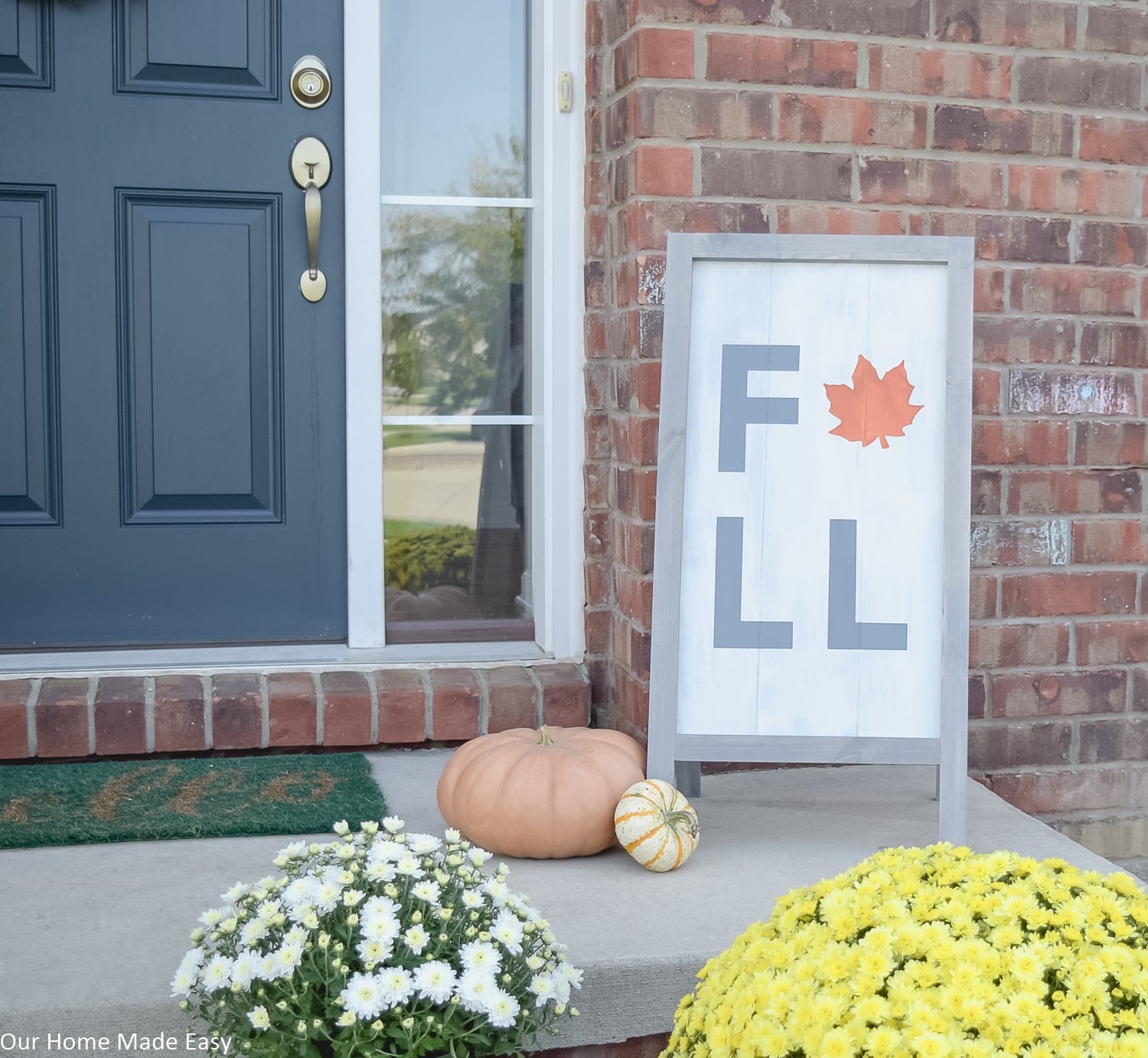 Yellow and white mums add color to this fall front porch