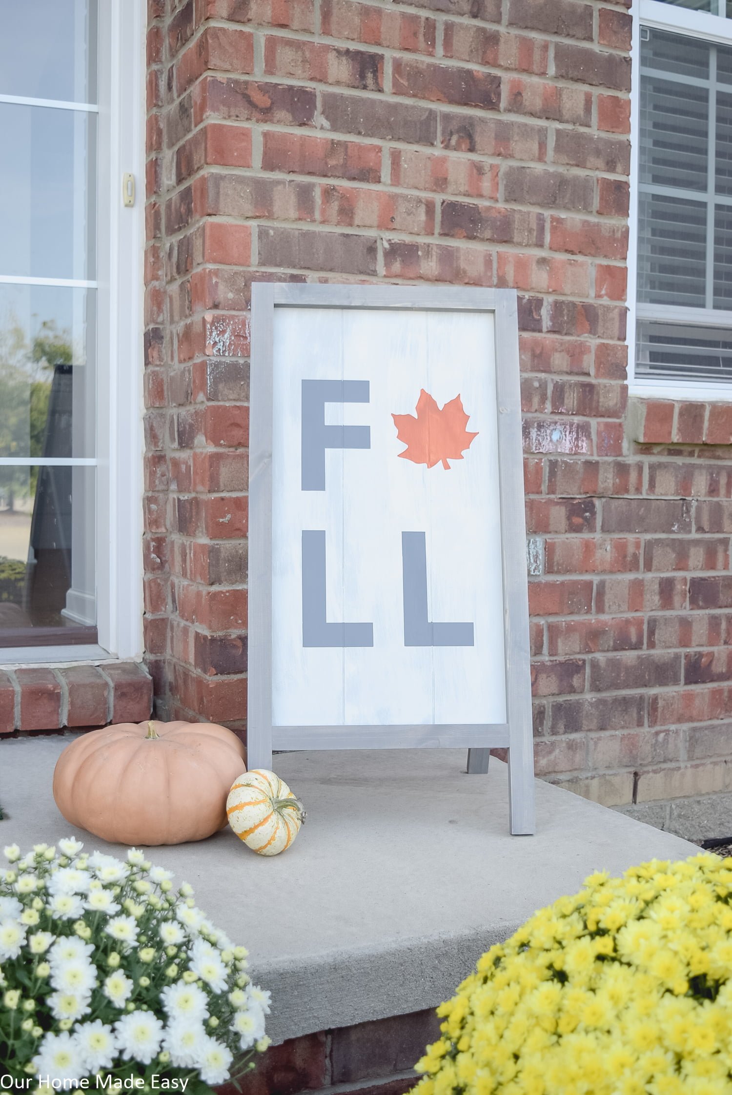 this fall harvest sign is a simple DIY project that is perfect for a fall decorated front porch