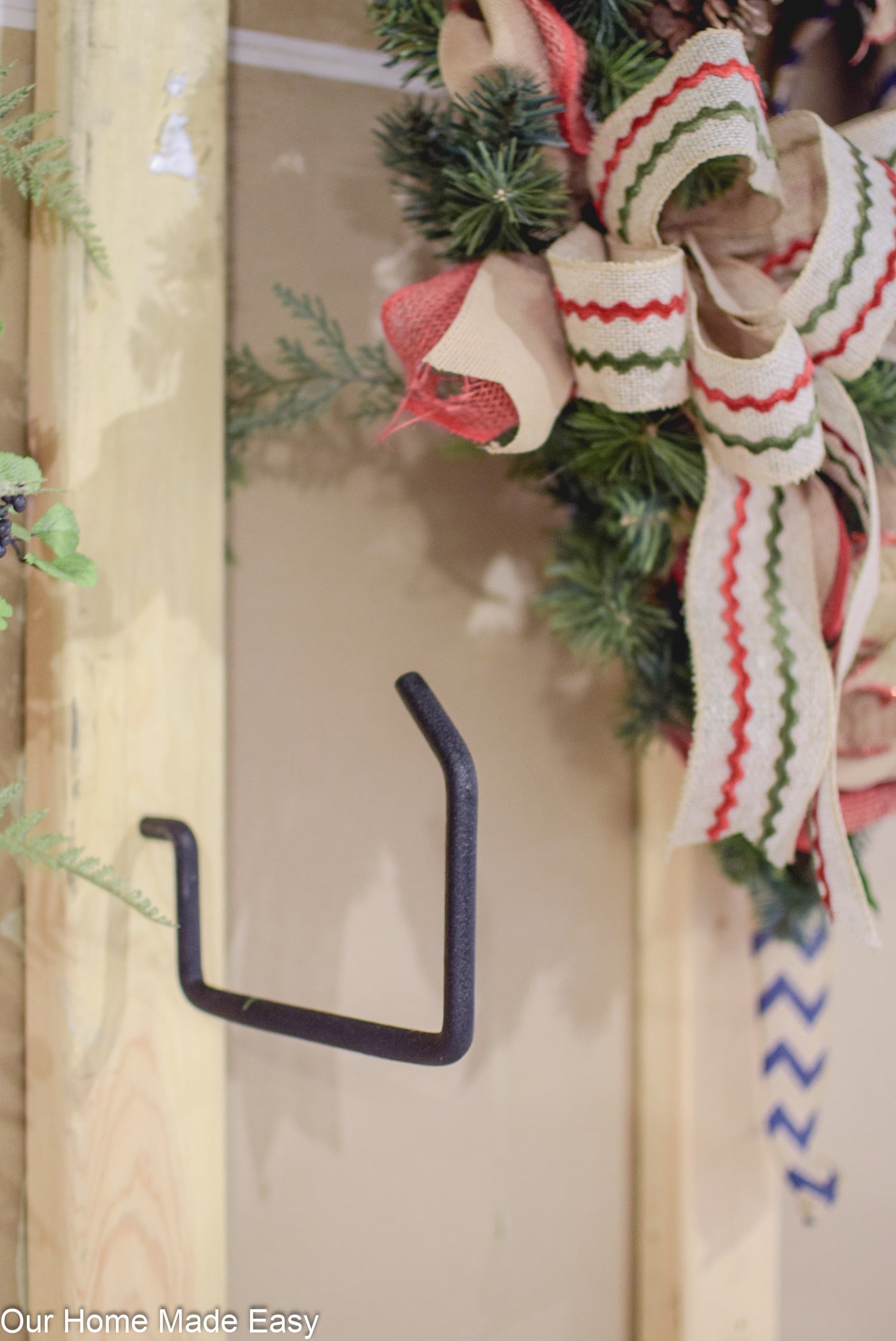 Add industrial hooks to your basement storage shelves for additional ways to hang and organize decorations