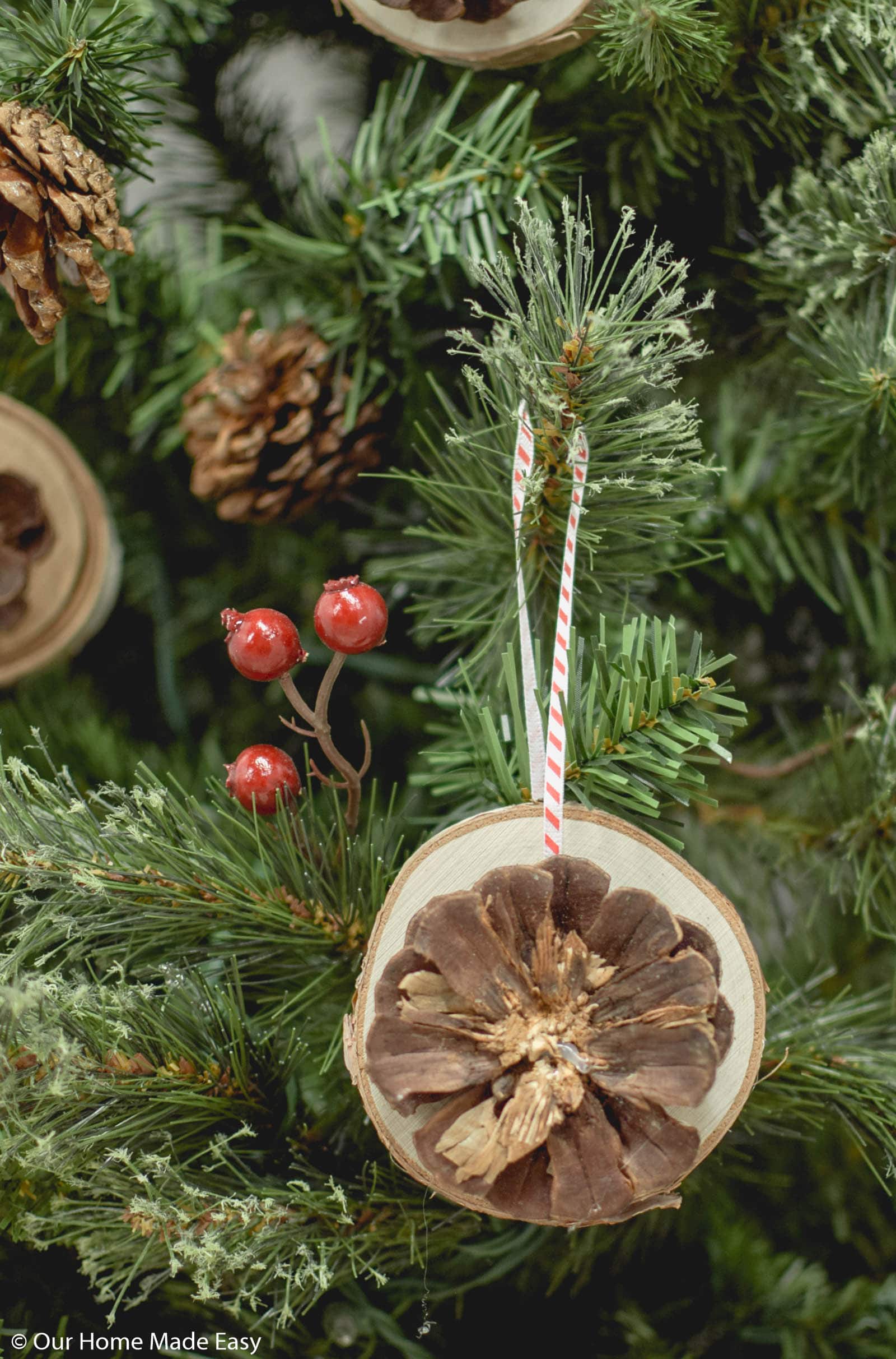 These easy wood slice ornaments are made with pine cones you can collect in your own backyard