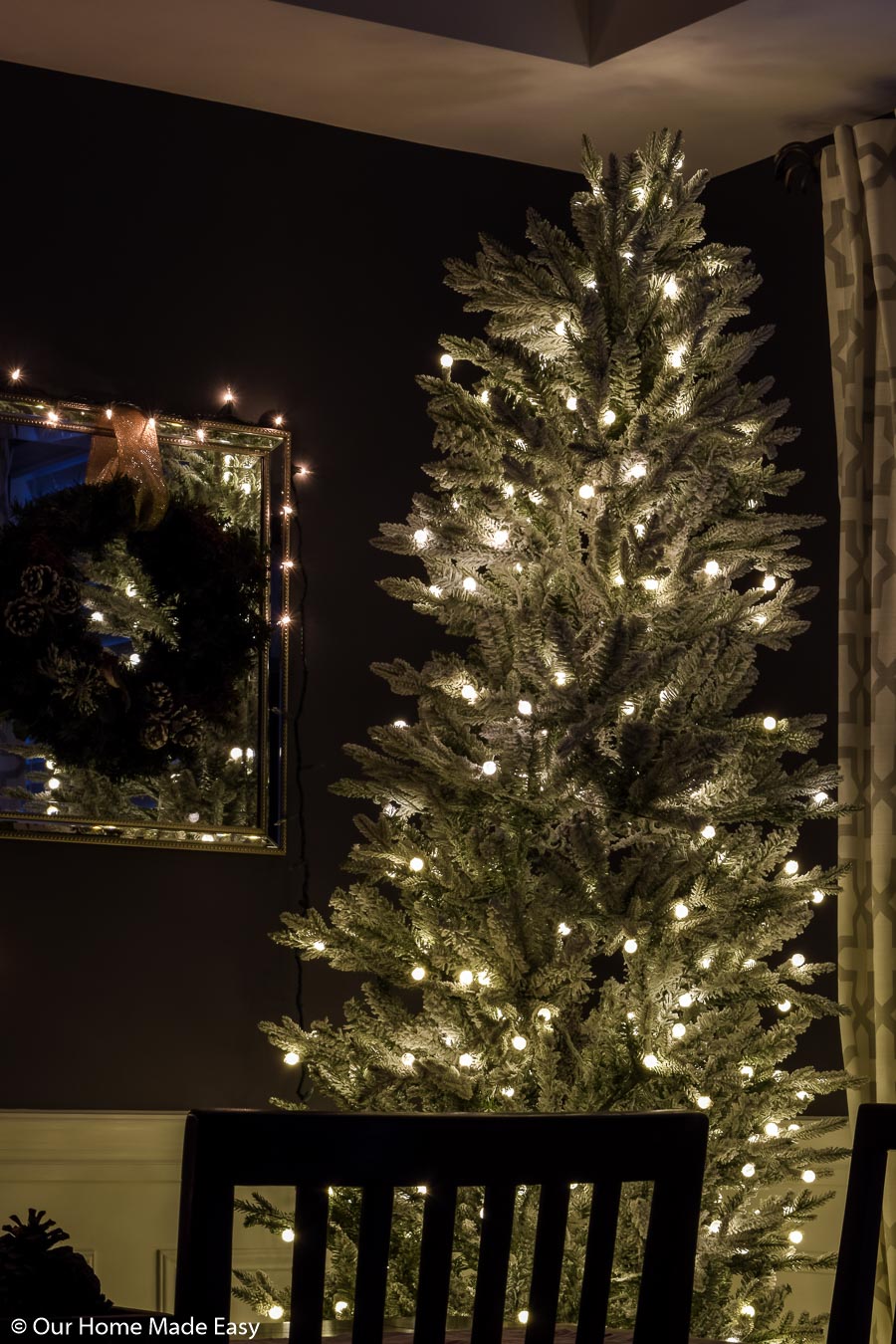 I love the simplicity of this all-white frosted branch Christmas tree with simple white lights