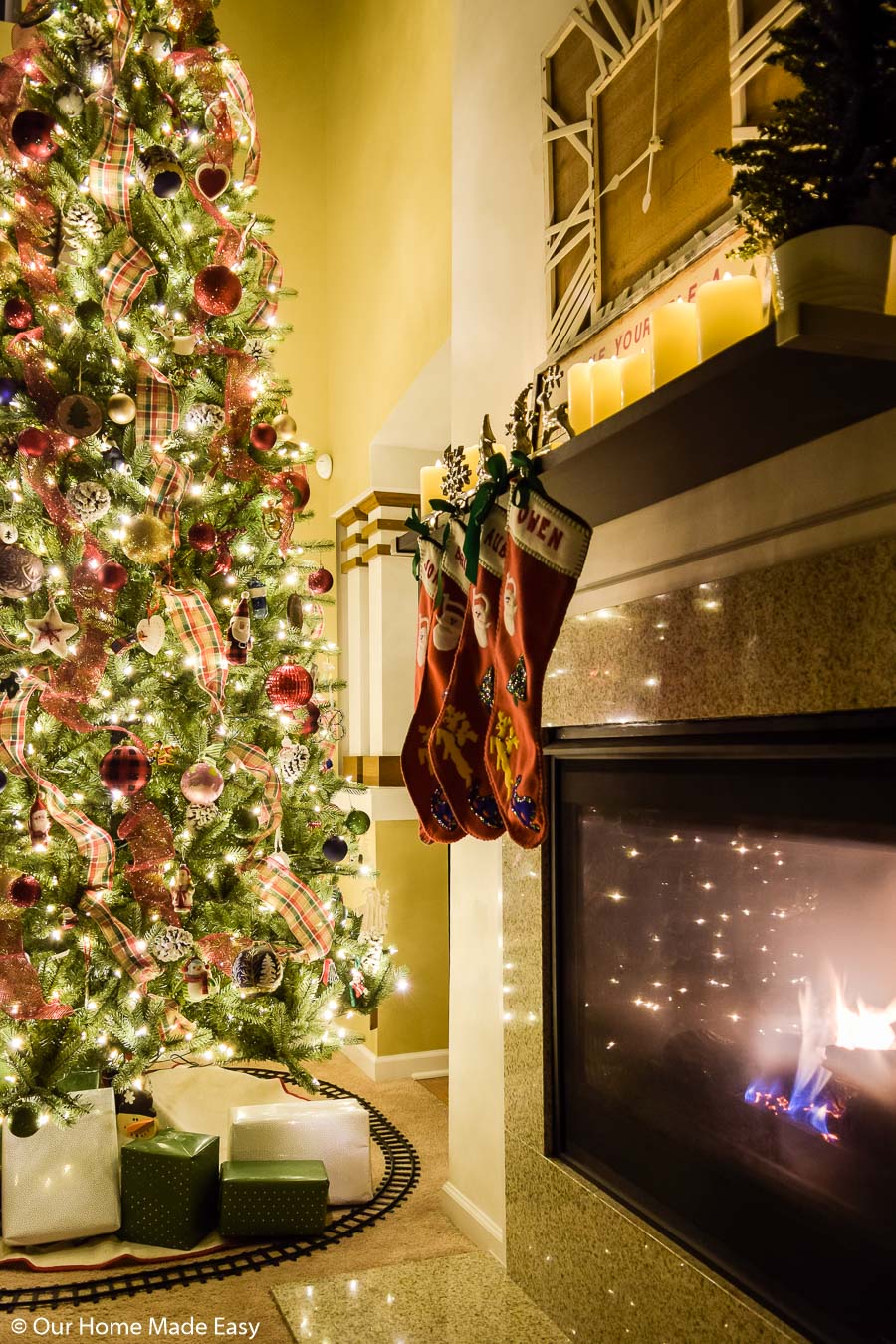 Our simple fireplace mantle is easily decorated for Christmas with our family's Christmas stockings and a few candles