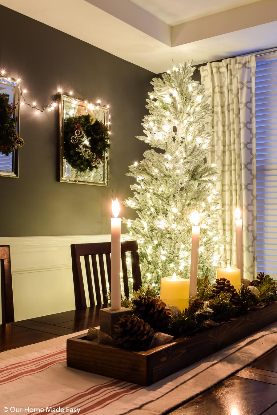 This all-white frosted Christmas tree brightens up our dining room