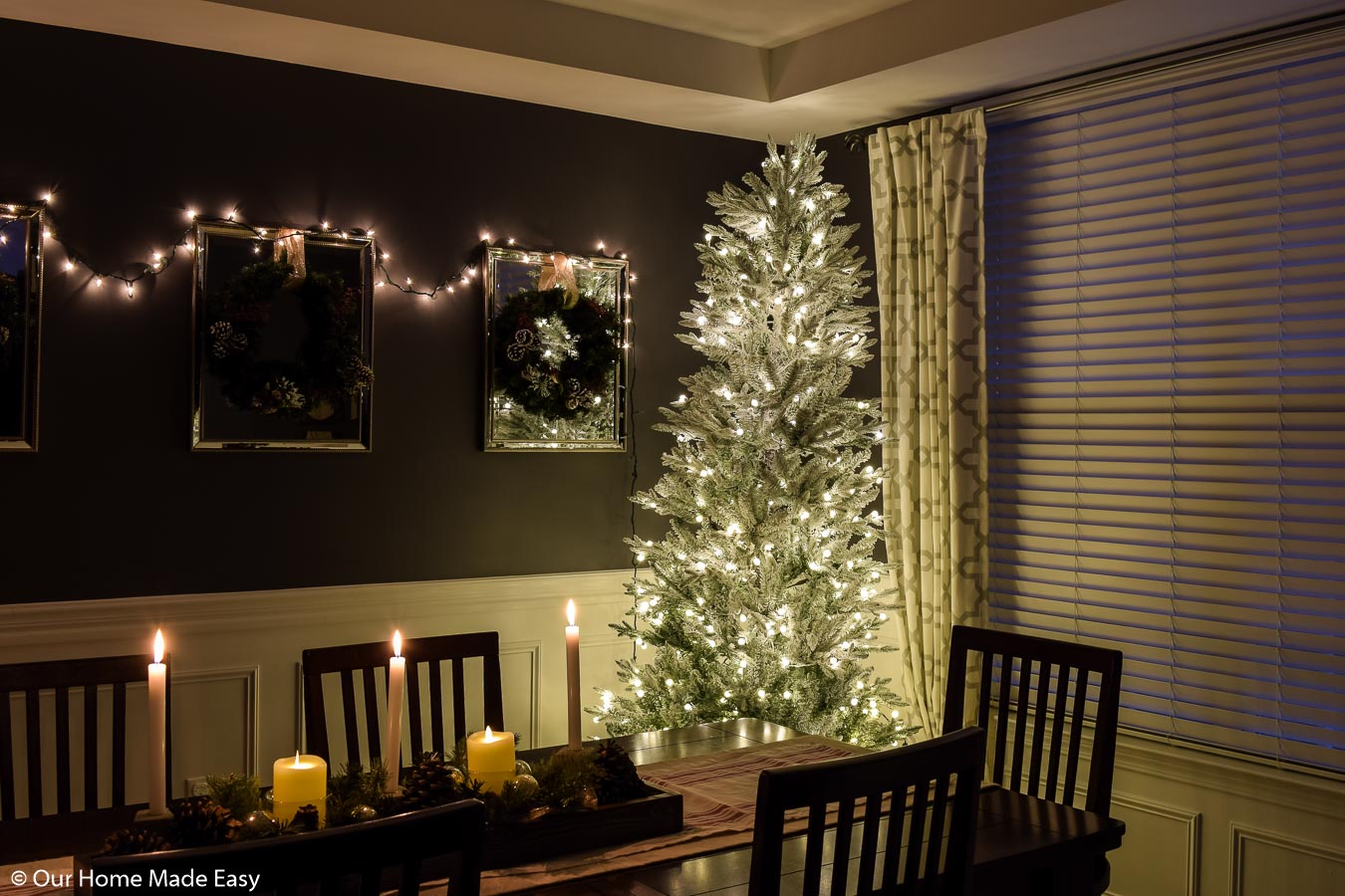 This white frosted branch Christmas tree is our dining room Christmas decoration, adorned in simple white Christmas lights