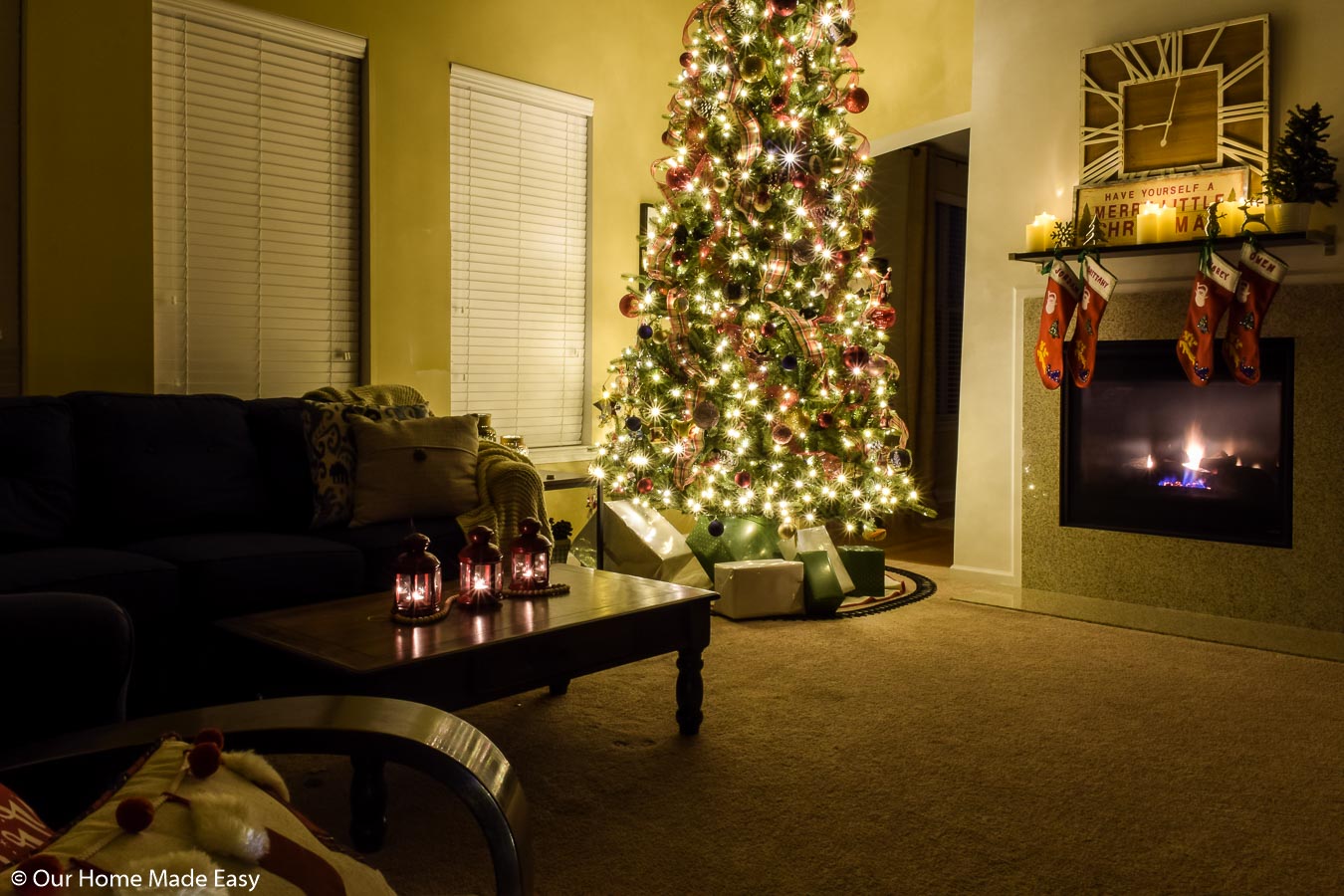 Our 12-foot Christmas tree owns our living room space with bright lights and festive decor