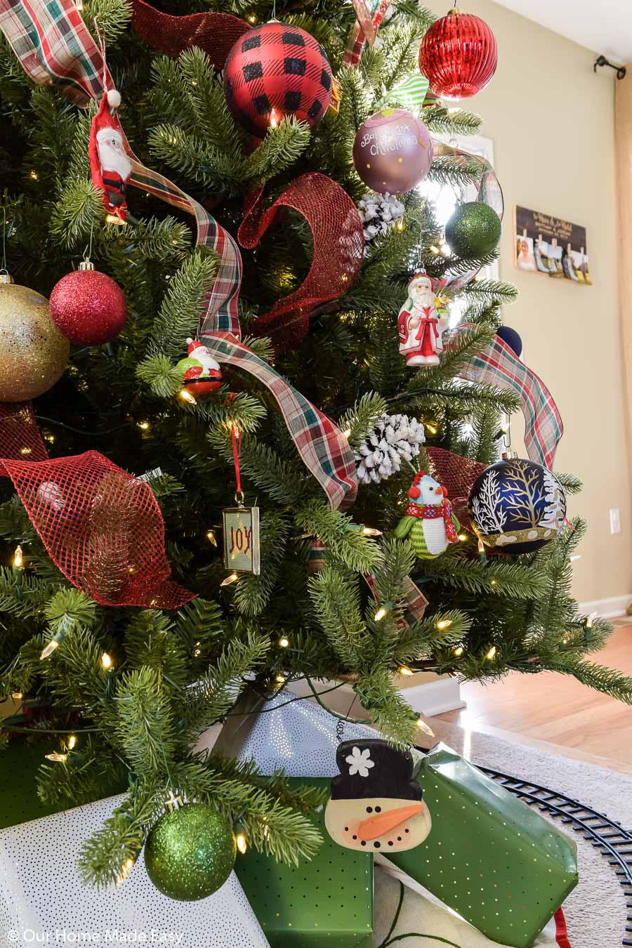 We decorated our Christmas tree with red and black buffalo check ribbon, and red mesh ribbon, along with our family ornaments
