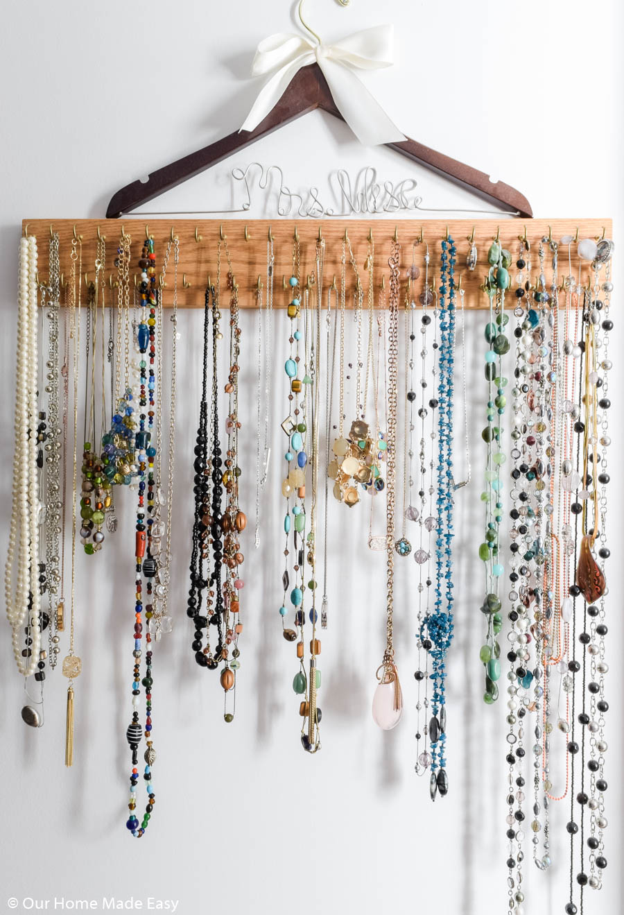 This DIY necklace rack is an easy way to organize jewelry 