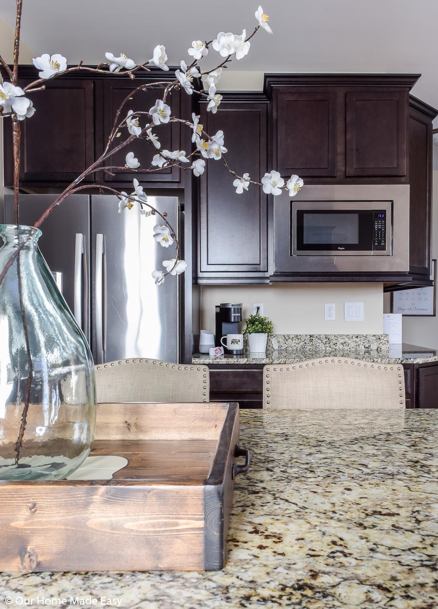 Make large spaces like the kitchen look appealing with accents like flowers and simple decor