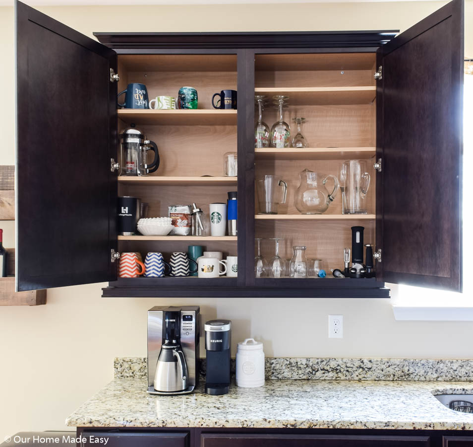 keeping your kitchen cabinets more organized is step one in decluttering your kitchen