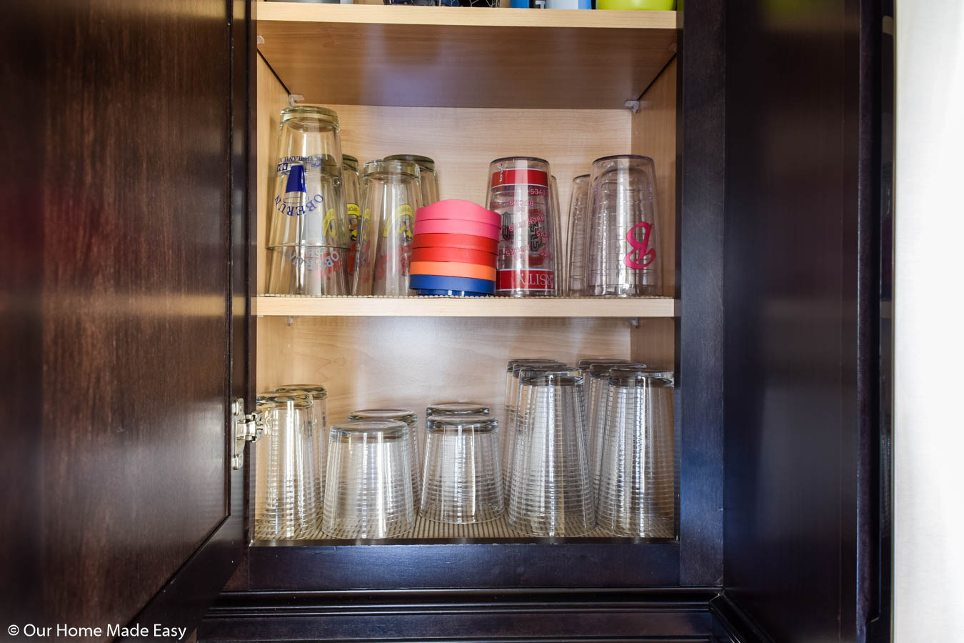keep drinking glasses stored close to the fridge for easy and convenient access