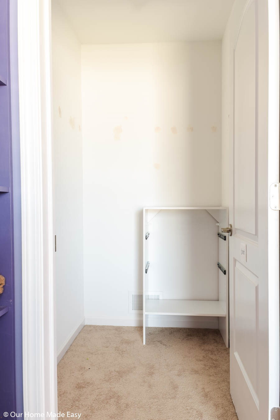 Next in our small closet organization project, we added a small 2-drawer dresser for added storage