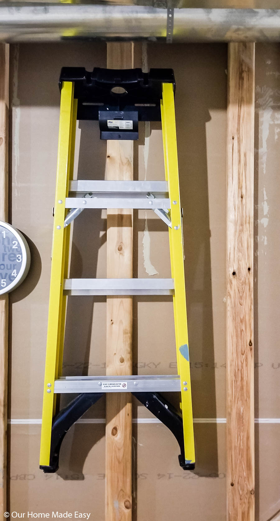 Our DIY basement storage shelves made room to organize and store things like ladders and other equipment