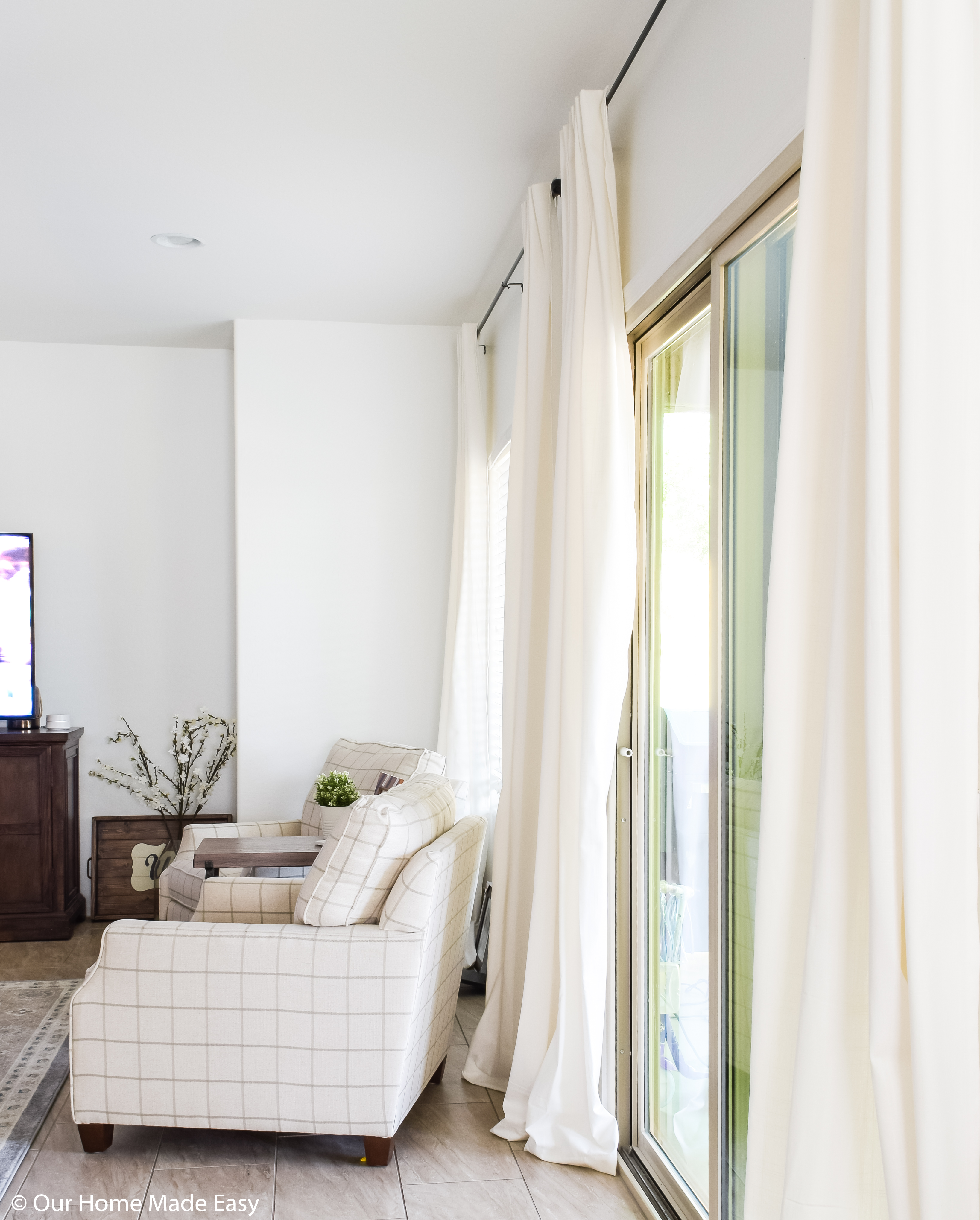 I love our extra-long hanging curtains! They make the room feel tall and full of light