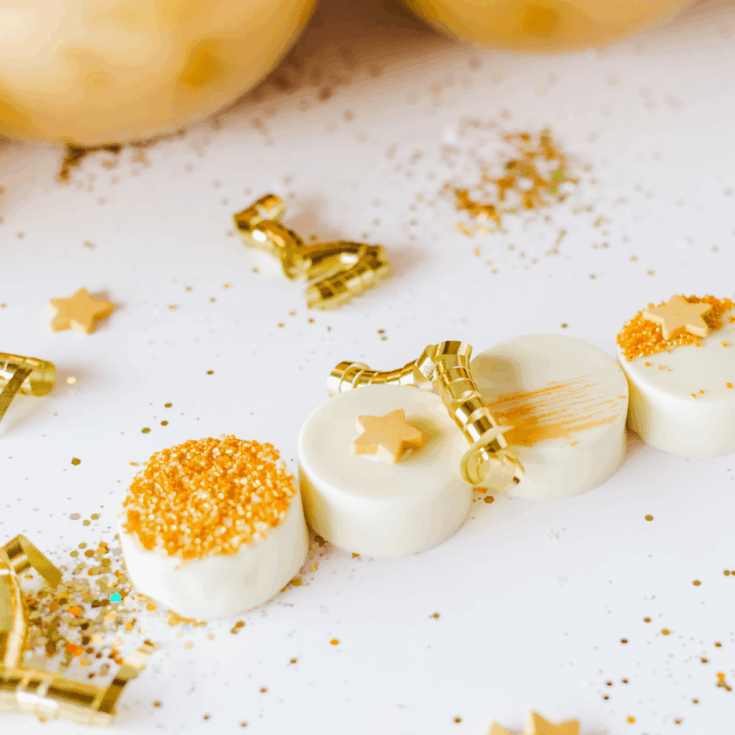 white chocolate dipped oreos on table