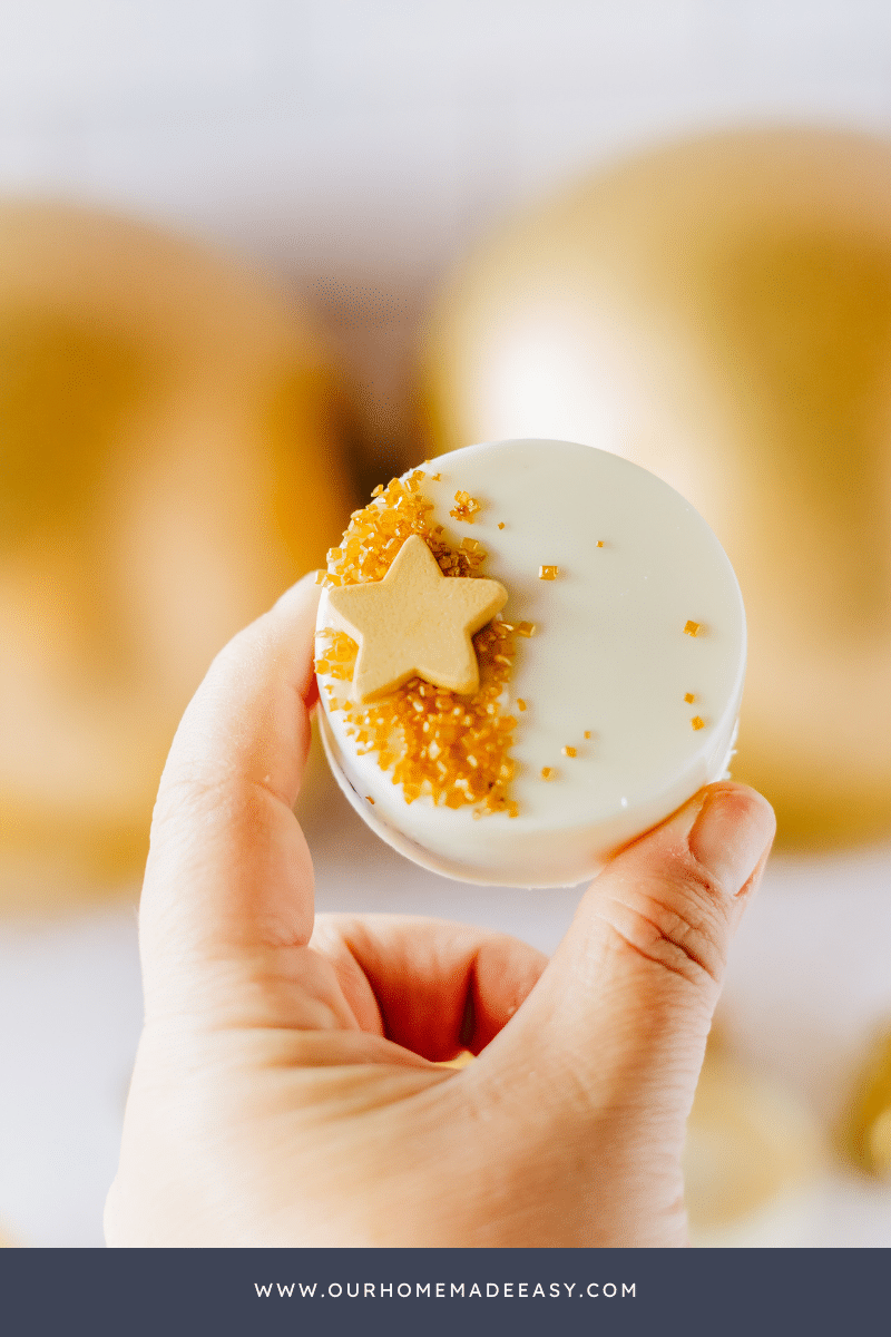 white chocolate dipped oreos in hand