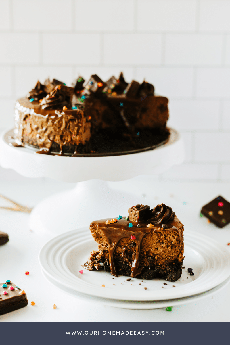 brownie chocolate cheesecake on cake pedestal