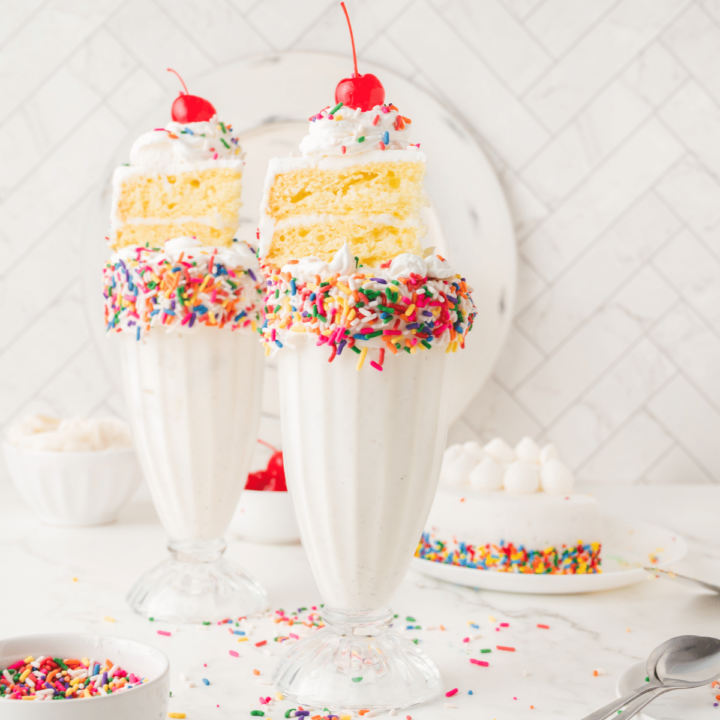 two birthday cake shakes on countertop