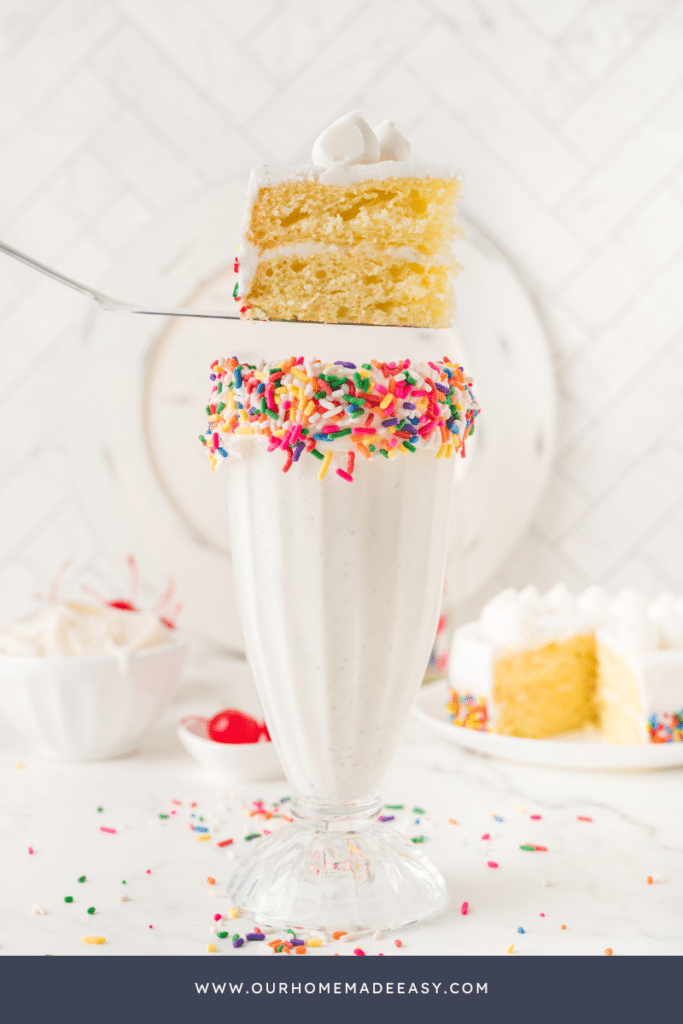 Slice of vanilla cake on top of vanilla milkshake