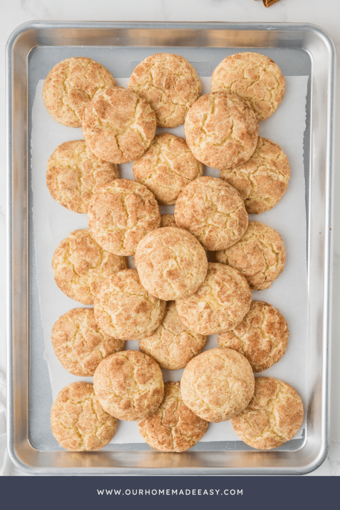 finished snickerdoodle cookies on baking sheet