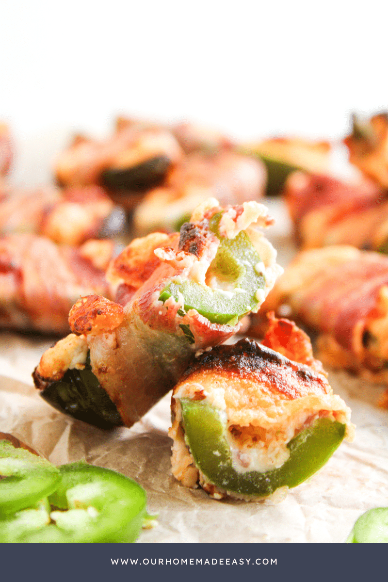 bite shot of bacon wrapped jalapeno poppers