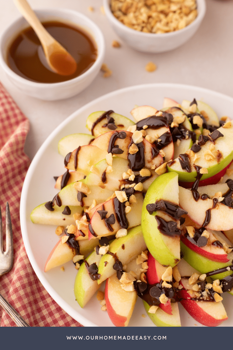 fresh apple dessert with hot fudge on white plate on table
