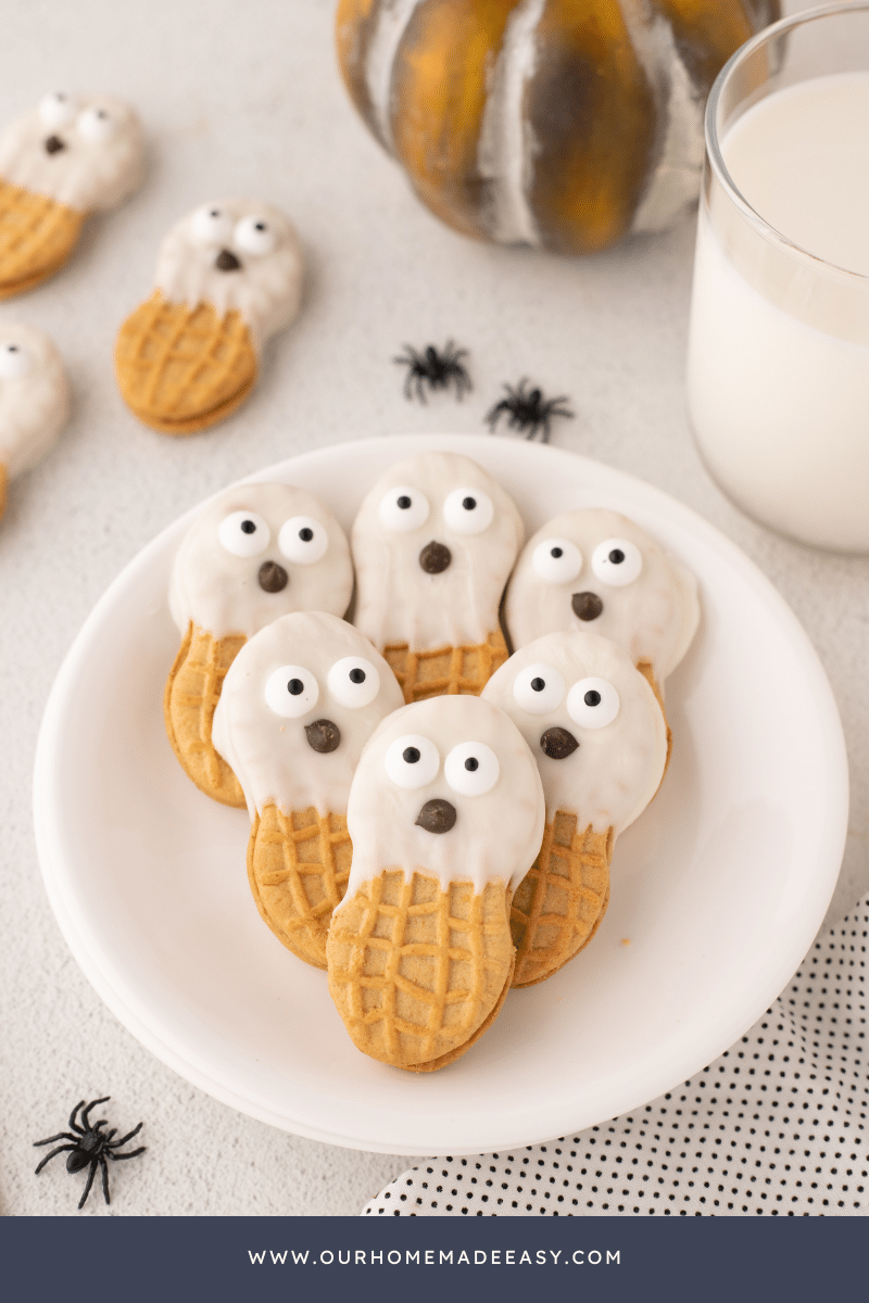Ghost Nutter Butter cookies stacked on white plate