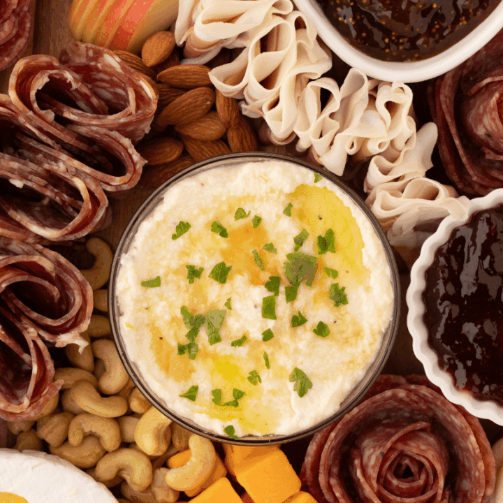 finished whipped ricotta dip surrounded by meat and cheese