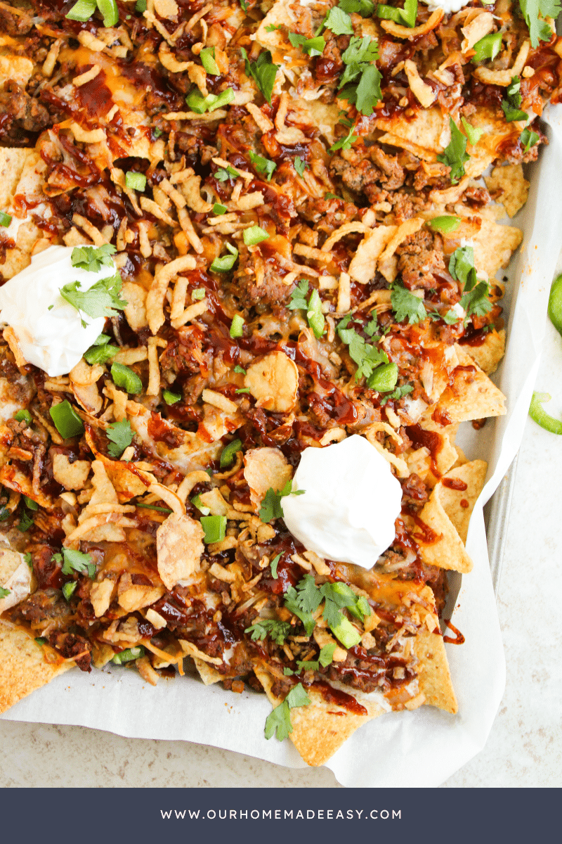 close up of finished nachos on sheet pan
