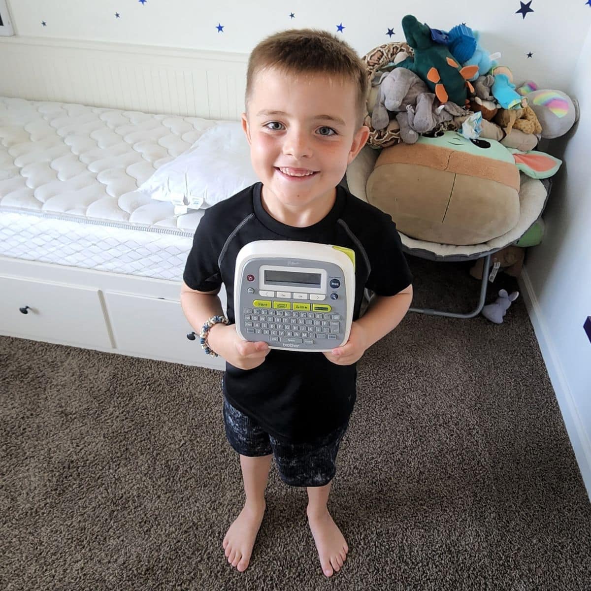 Boy holding Label maker
