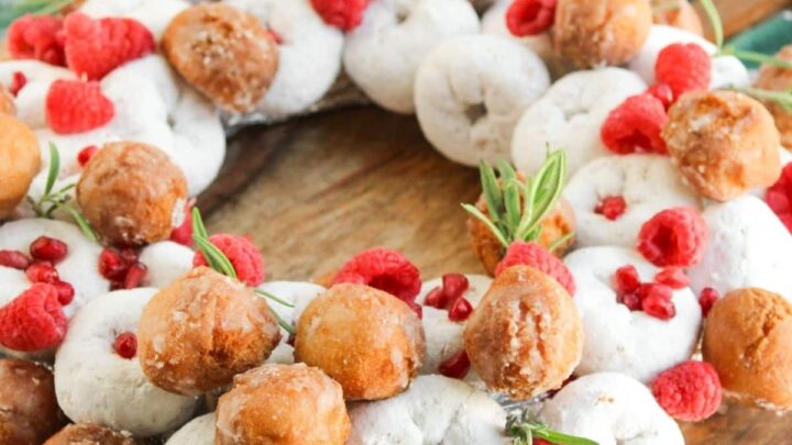 finished no bake mini powdered donuts assembled in a Christmas wreath shape with donut holes