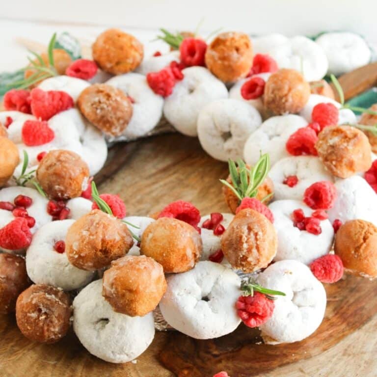 finished no bake mini powdered donuts assembled in a Christmas wreath shape with donut holes