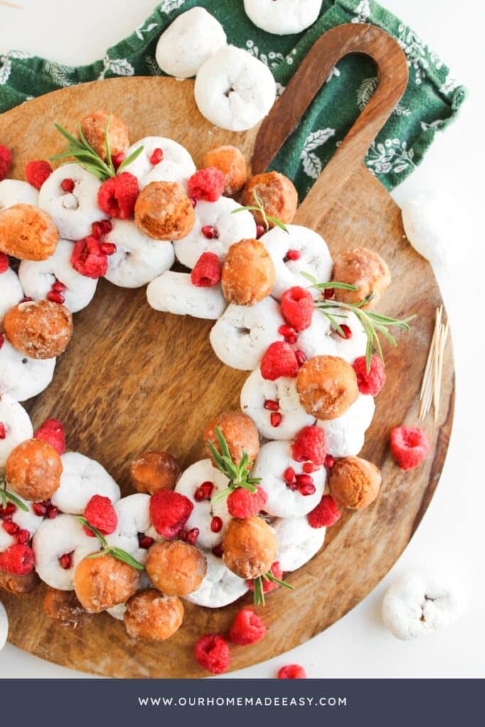 Finished Christmas Mini Donuts wreath no bake on wooden board
