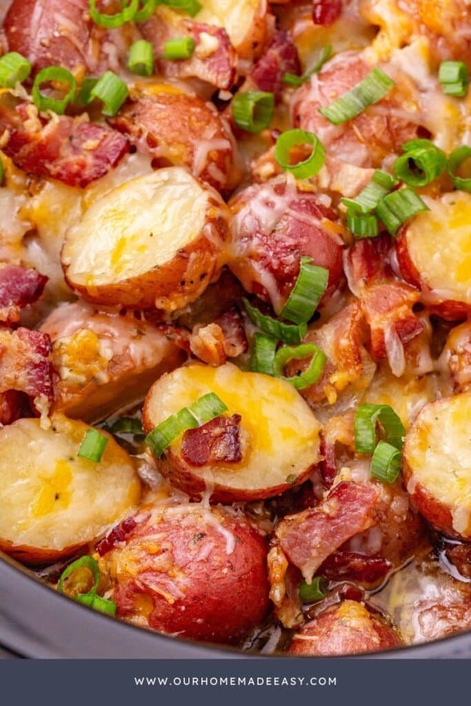 close up of finished baby red potatoes with cheese, green onions, and ranch seasoning.