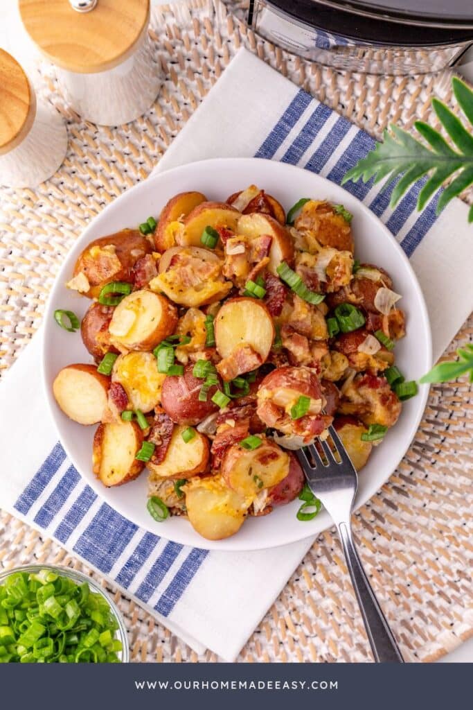 looking down at white plate with roasted  potatoes