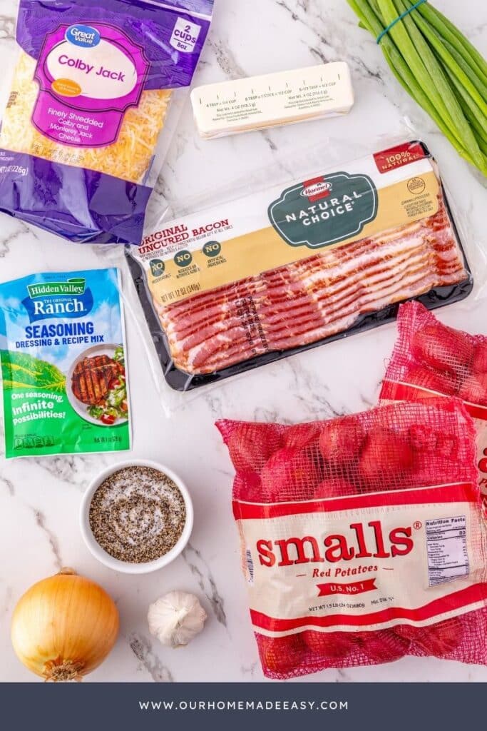 looking down at slow cooker potatoes ingredients on marble counter top
