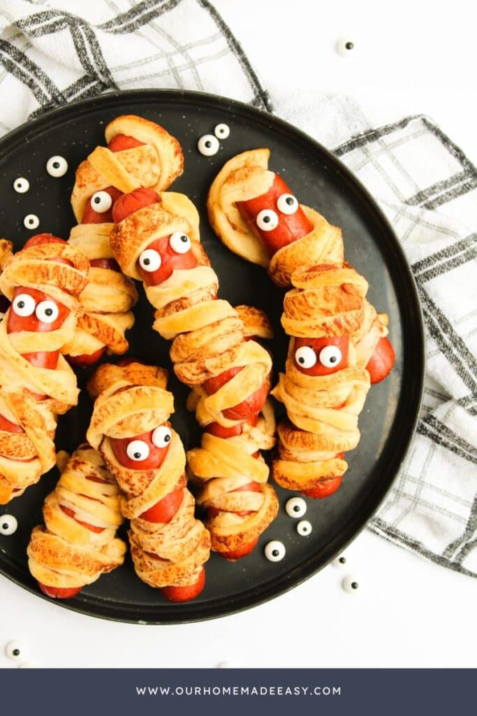 finished mummies in a blanket using cheddar sausages