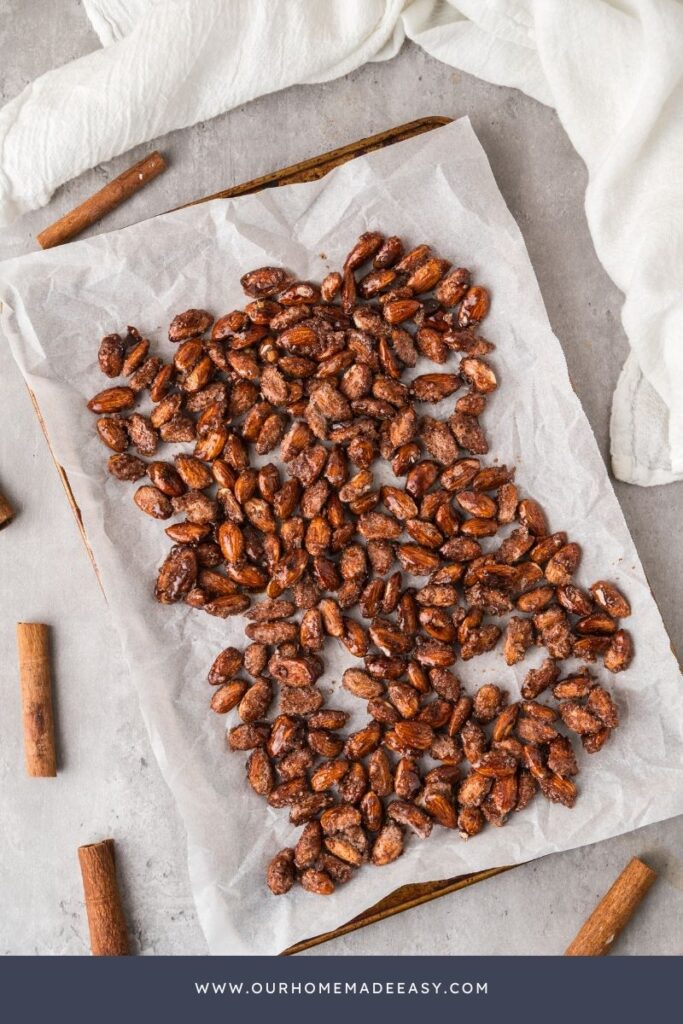 cinnamon candy almonds drying on baking sheet